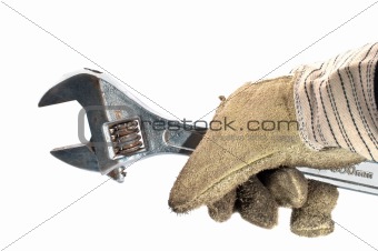 Dirty leather gloves and monkey wrench