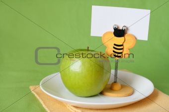Green apple for breakfast clothespin with card for text