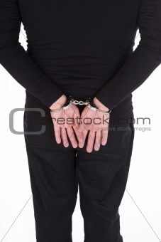 thief's hands in handcuffs