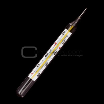 Medical glass thermometer isolated on black background