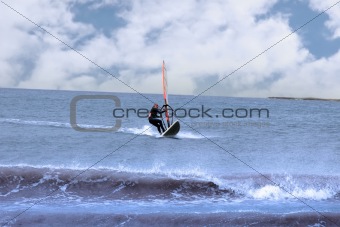 surfer windsurfing in a storm