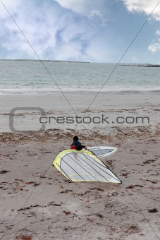windsurfer getting board ready to surf