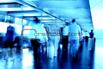 busy people in blurred motion