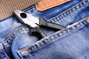 pliers in the jeans' pocket