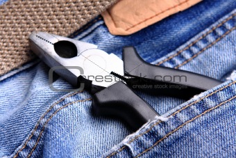 pliers in the jeans' pocket