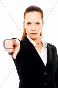 severe businesswoman with her hand indicating on white background studio