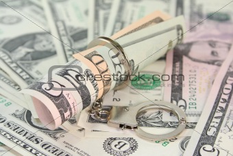 Dollar bills with handcuffs