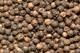 Background of black pepper - extreme close up