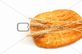 Bread and wheat ears isolated on white