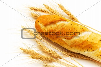 Bread and wheat ears isolated on white