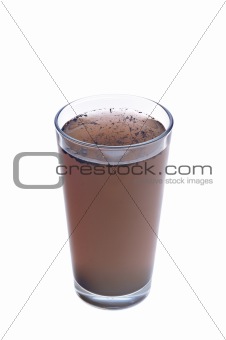 Dirty water in glass isolated on white background
