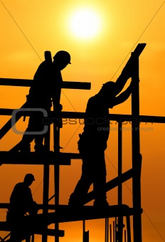 Construction workers under a hot blazing sun