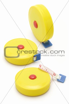 Three yellow measuring tapes