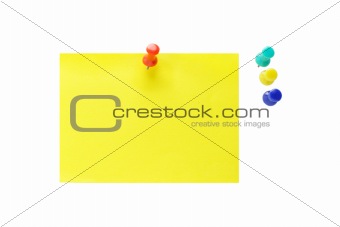 Push pins and yellow note paper 