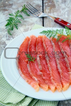 Salted salmon red fish sliced ​​on a plate