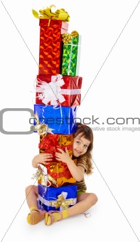 Little girl hugs birthday gifts