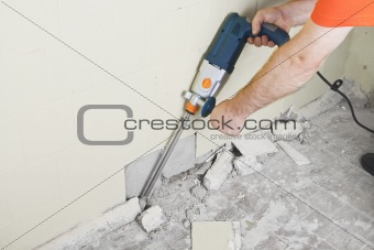 House-builder working with a perforator