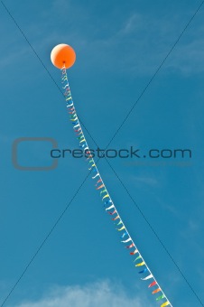 Balloon with Streamers in a Blue Sky