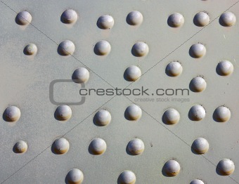 A silver painted metal aircraft background  with  rivets.