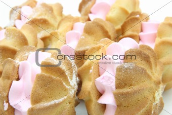 Yellow cookies with a  stuffing  on a white background 