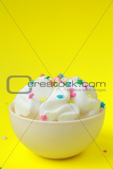 ice cream in a white cup on yellow background