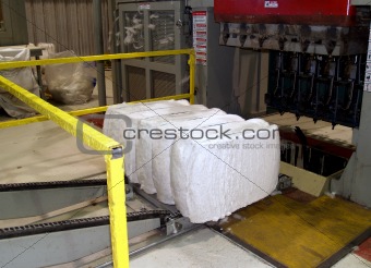 Completed Cotton Bale Being Pushed from a Bale Press