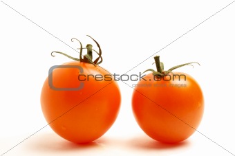 two red tomato on white