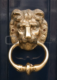 Antique golden door knocker