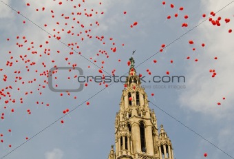 Red balloons in front of the town hall in Vienna, Austria