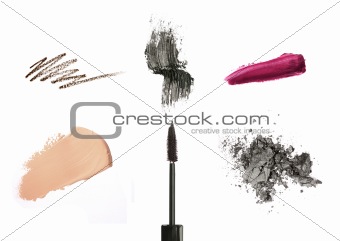Cosmetic products isolated on white: mascara, lip gloss or lipstick, concealer, eyeliner