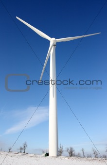 Windmill against deep blue sky