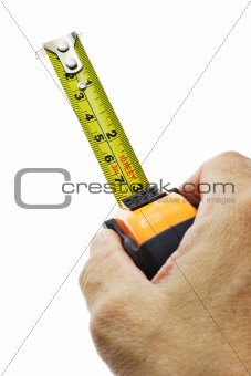 Hand holding measuring tape