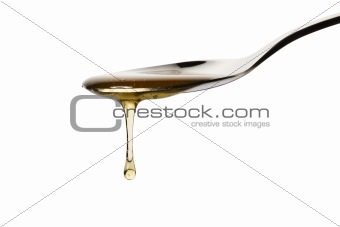 honey drops from a spoon