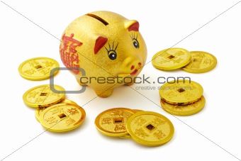 Chinese gold piggy bank and coins