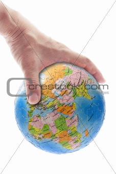 Hand gripping globe