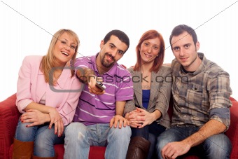 Young Group Watching TV on Sofa