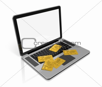 gold credit cards on laptop