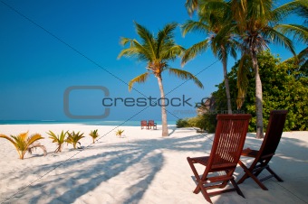 beach chairs on a perfect tropical island