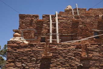 Southwestern Hopi House 1905 Architecture Abstract with Wooden Ladders and Clear Blue Sky.