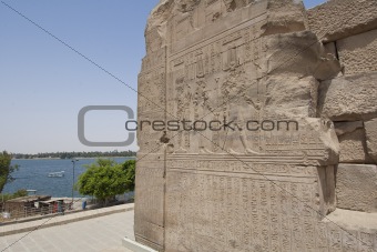 Hieroglyphic carvings outside on an Egyptian temple wall