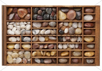 river pebbles in typesetter drawer