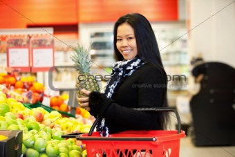 Asian Woman Buying Fruit