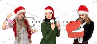 Three girls in Christmas hat with gift