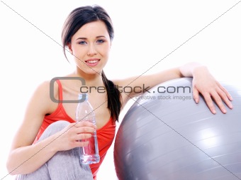 Young and beautiful girl with bottle of mineral water