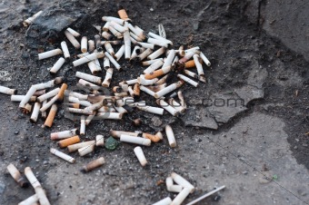 Pile of cigarettes on ground