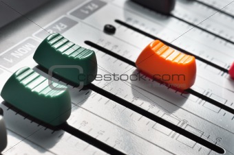 Part of an audio sound mixer with buttons