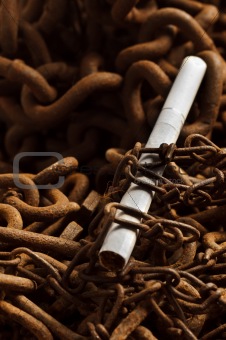 Chains holding down cigarette