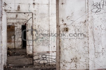 Abandoned building interior with white walls