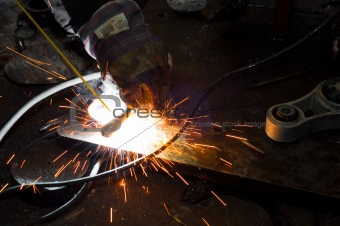 Welding plates togather with sparks