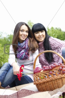 Mother and daughter relaxing outdoors